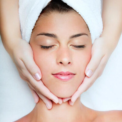 Woman receiving a facial